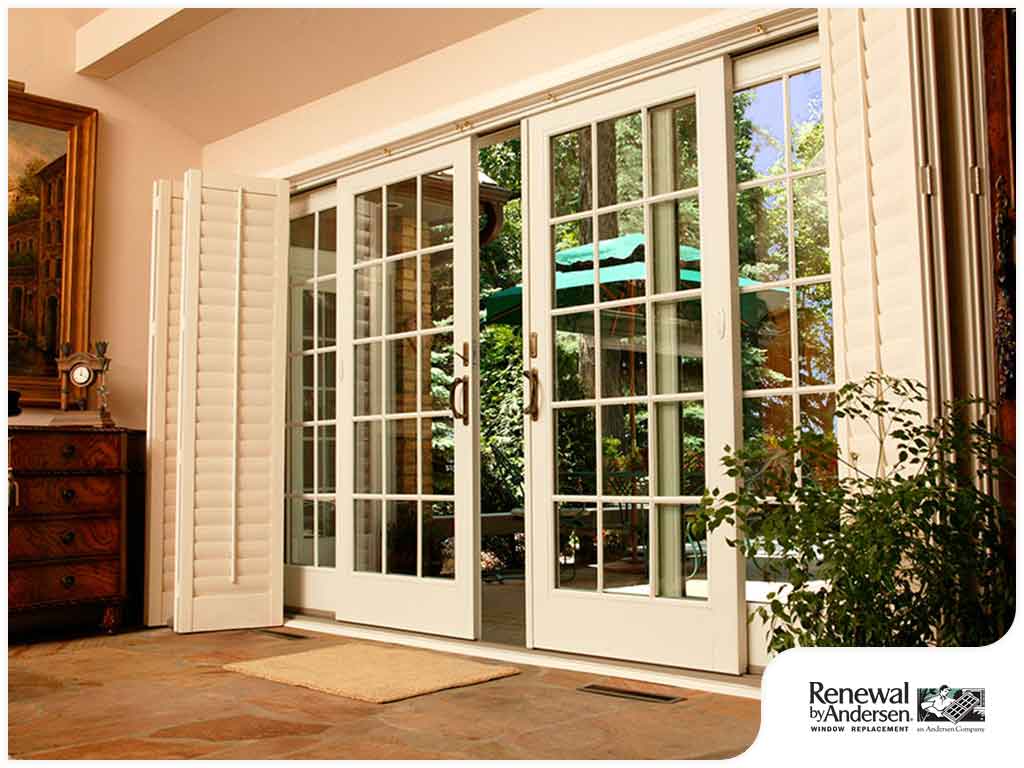 Patio Doors Milwaukee WI Interior living area with tile flooring, dresser in corner, and a pair of sliding patio doors leading to outdoor living space.