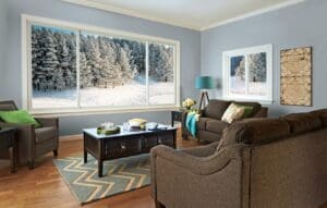 expansive picture windows in a sitting room overlooking a snowy exterior